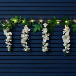 Solar Powered 180cm Artificial Leaf Garland With Wisteria Flowers - Warm White 8 Solar Powered 180cm Artificial Leaf Garland With Wisteria Flowers - Warm White -B and M Shop 379258 180cm solar powered artificial leaf garland with wisteria flowers 20 warm white micro leds 3